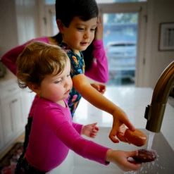 Muse Threads Festive Pink Long Sleeve Bodysuit